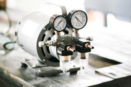 a couple of gauges sitting on top of a table